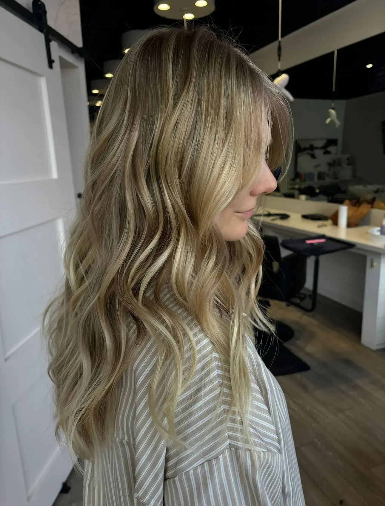 Soft, dimensional blonde waves finished at the chair
